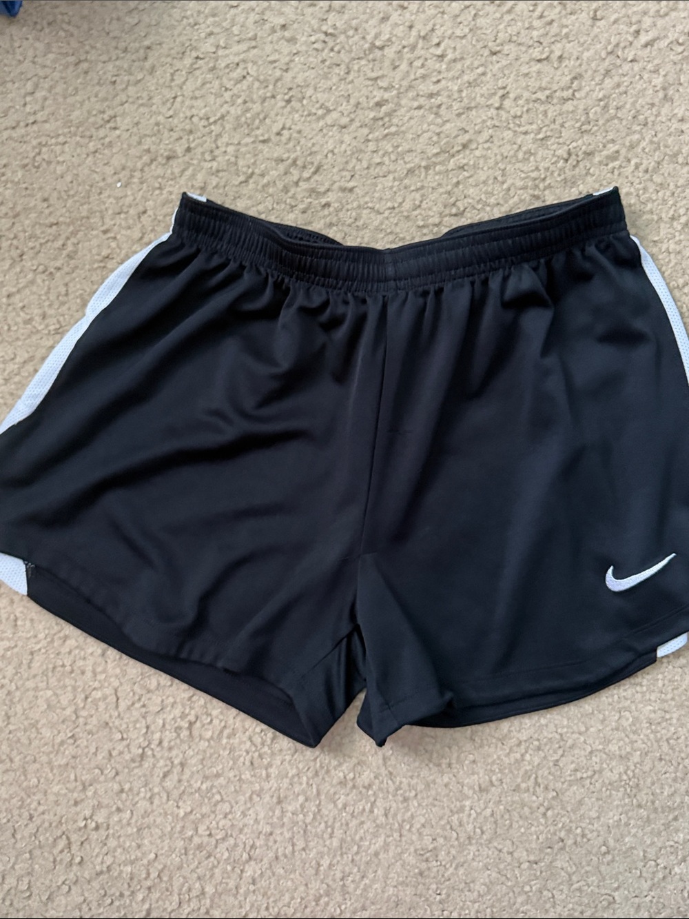 Nike Black Women's Athletic Shorts with White Swoosh and Side Panels